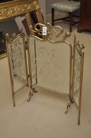 Lot 657 - A Victorian mirrored triptych fire screen in...