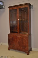 Lot 662 - A Georgian style inlaid mahogany bookcase,...