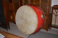 Lot 646 - A large Chinese ceremonial drum, painted red...