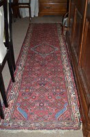 Lot 651 - A central Persian runner with small...
