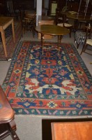 Lot 656 - A Heriz carpet with bold geometric forms on a...