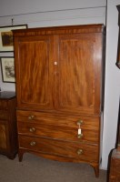 Lot 678 - A George III mahogany press cupboard, the...