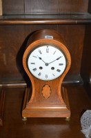 Lot 695 - An Edwardian mantel clock in inlaid rosewood...