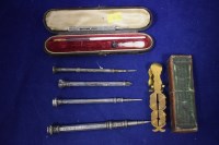 Lot 140 - Four 19th Century silver extending propelling...