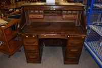 Lot 598 - An early 20th Century oak roll top desk, 120cms.