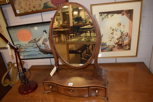 Lot 682 - A Georgian oval swing toilet mirror, fitted...