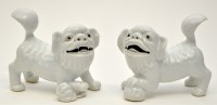 Lot 12 - Two Chinese white ware Buddhist lions, one...