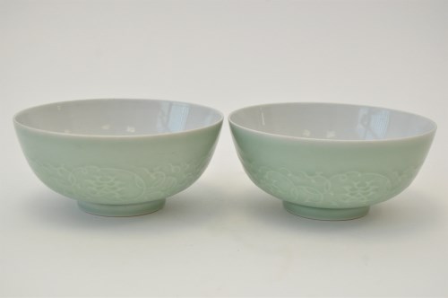Lot 17 - Pair of carved Chinese celadon bowls, the...