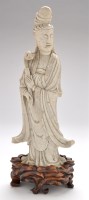 Lot 46 - Large Chinese hardstone figure of Guanyin, her...