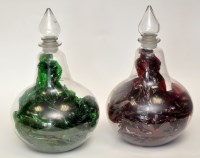 Lot 63 - Pair of clear glass bottle shape chemist's...