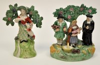 Lot 110 - Two Staffordshire figure groups, comprising:...