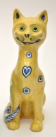 Lot 136 - Masonic Faience figure of a seated cat, yellow...