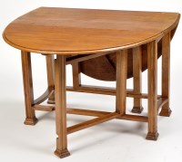 Lot 337 - An early 20th Century oak drop-leaf dining...