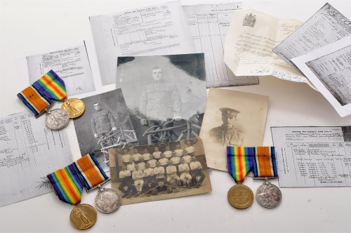 Lot 384 - WWI Family medals, to include: a pair of...