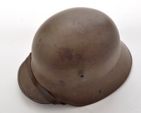 Lot 442 - A German WWI M16 helmet, the Feldgrau (field...