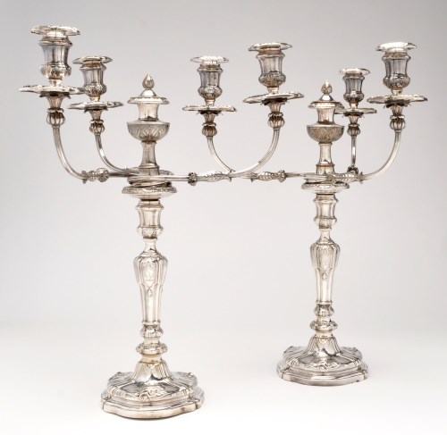 Lot 492 - A pair of George III silver candlesticks, by...