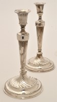 Lot 495 - A pair of George III silver candlesticks, by...