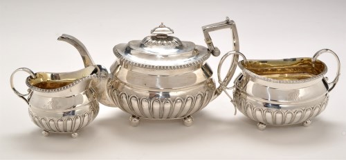 Lot 499 - A George III silver three-piece tea service,...