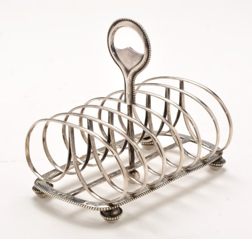 Lot 504 - A Victorian silver seven bar toast rack, by...