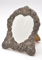 Lot 541 - A Victorian silver mounted table mirror, by...