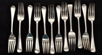 Lot 549 - Eleven George III silver table forks, by...