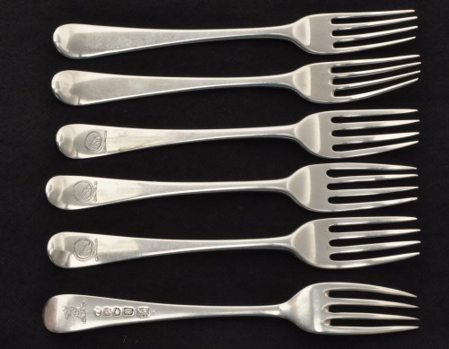 Lot 552 - Four George III silver dessert forks, by...