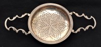 Lot 561 - A George III silver straining dish, by John...