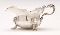 Lot 568 - A George II silver sauce boat, by George...