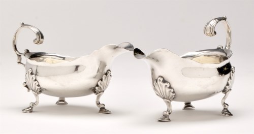 Lot 570 - A pair of George V silver gravy boats, by...
