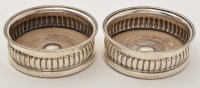 Lot 572 - A pair of George III silver mounted coasters,...