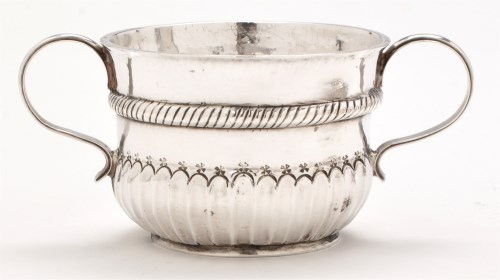 Lot 573 - A Queen Anne silver porringer, by Y.C., likely...
