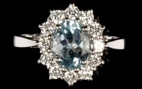 Lot 640 - An aquamarine and diamond cluster ring, the...