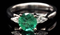 Lot 641 - An emerald and diamond ring, the circular...