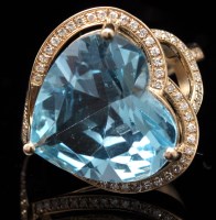 Lot 651 - A topaz and diamond dress ring, the...