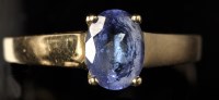 Lot 654 - A tanzanite ring, the oval facet cut tanzanite...