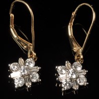 Lot 658 - A pair of diamond drop earrings, each set with...