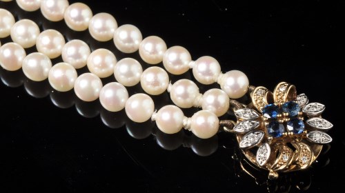Lot 659 - A modern cultured pearl triple row necklace,...