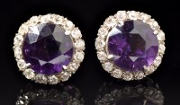 Lot 660 - A pair of amethyst and diamond cluster rings,...