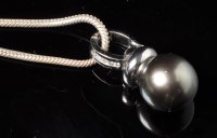 Lot 673 - A Tahitian black pearl and diamond pendant,...