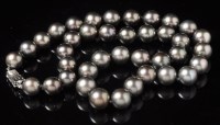 Lot 674 - A slightly graduated Tahitian black pearl...