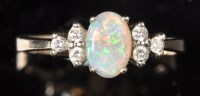 Lot 682 - An opal and diamond ring, the oval opal...