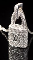 Lot 683 - A Louis Vuitton ''Lockit'' pendant, encrusted...