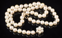 Lot 686 - A single row cultured pearl necklace, each...