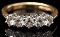 Lot 697 - A five stone diamond ring, the brilliant-cut...