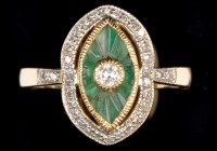 Lot 698 - An emerald and diamond dress ring, the...