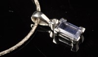 Lot 707 - A tanzanite and diamond drop pendant, the...