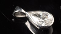 Lot 717 - A diamond pendant, the pear-cut diamond...