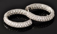 Lot 721 - A pair of diamond earrings, by Rox, set to the...