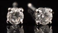 Lot 725 - A pair of diamond stud earrings, each of the...