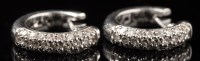 Lot 727 - A pair of diamond earrings, the fronts set...